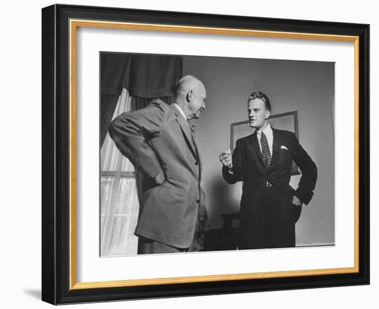 Evangelist Billy Graham Visiting with Pres. Dwight Eisenhower at the Wh-Paul Schutzer-Framed Photographic Print