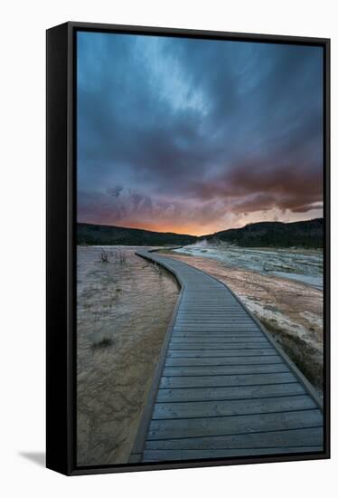 Evening Storm Clouds Gather Over A Boardwalk In Biscuit Basin, Yellowstone National Park-Bryan Jolley-Framed Stretched Canvas