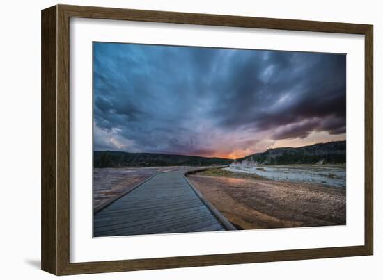 Evening Storm Clouds Gather Over A Boardwalk In Biscuit Basin, Yellowstone National Park-Bryan Jolley-Framed Photographic Print