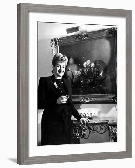 Evita Peron, Wife of Argentinean Presidential Candidate With. a Glass of Champagne in Her Apartment-Thomas D^ Mcavoy-Framed Premium Photographic Print