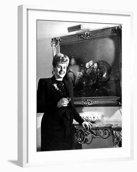 Evita Peron, Wife of Argentinean Presidential Candidate With. a Glass of Champagne in Her Apartment-Thomas D^ Mcavoy-Framed Premium Photographic Print