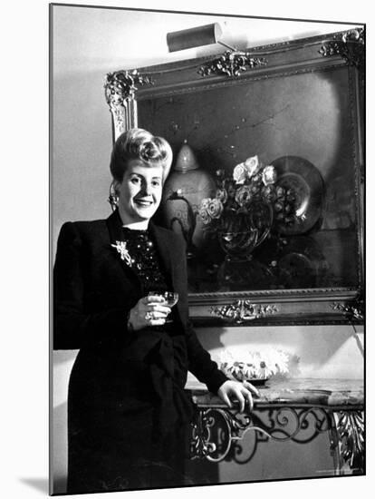 Evita Peron, Wife of Argentinean Presidential Candidate With. a Glass of Champagne in Her Apartment-Thomas D^ Mcavoy-Mounted Premium Photographic Print