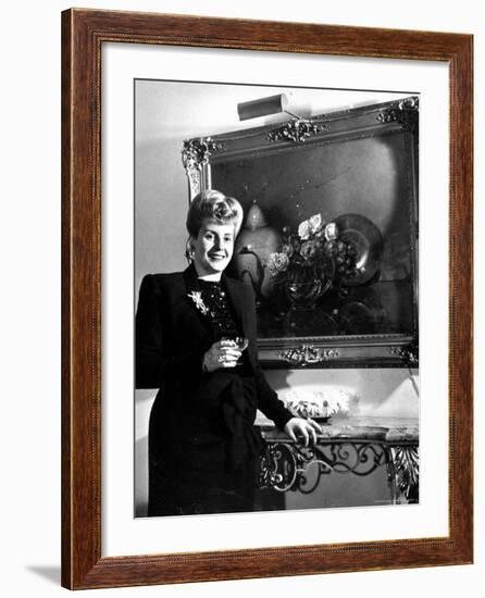 Evita Peron, Wife of Argentinean Presidential Candidate With. a Glass of Champagne in Her Apartment-Thomas D^ Mcavoy-Framed Premium Photographic Print