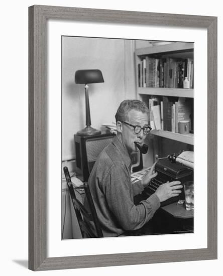 Excellent of Pulitzer Prize Winning Journalist Murray Kempton Smoking Pipe at Typewriter-Martha Holmes-Framed Premium Photographic Print