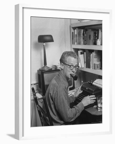 Excellent of Pulitzer Prize Winning Journalist Murray Kempton Smoking Pipe at Typewriter-Martha Holmes-Framed Premium Photographic Print