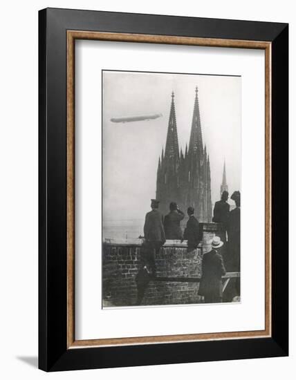 Excited Spectators Watching a Zeppelin Z111 Fly Over Cologne Cathedral Germany-null-Framed Photographic Print