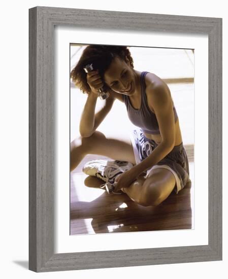 Exerciser Resting Holding Handweights-null-Framed Photographic Print