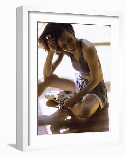 Exerciser Resting Holding Handweights-null-Framed Photographic Print