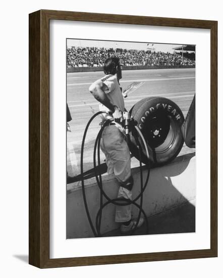 Expert Mechanic Waiting for a Car to Stop During the Daytona 500 Autorace-null-Framed Photographic Print