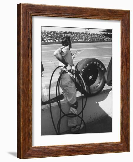 Expert Mechanic Waiting for a Car to Stop During the Daytona 500 Autorace-null-Framed Photographic Print