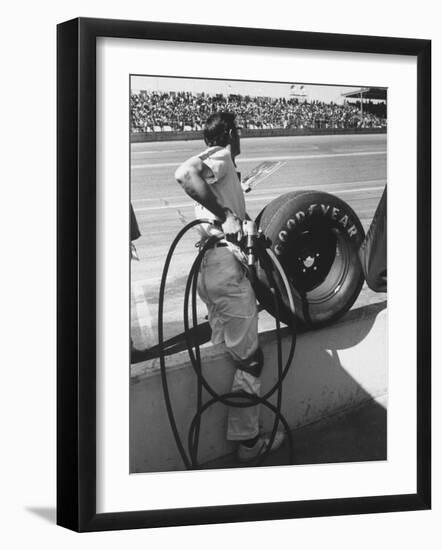 Expert Mechanic Waiting for a Car to Stop During the Daytona 500 Autorace-null-Framed Photographic Print