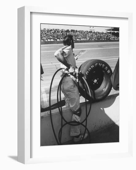 Expert Mechanic Waiting for a Car to Stop During the Daytona 500 Autorace-null-Framed Photographic Print