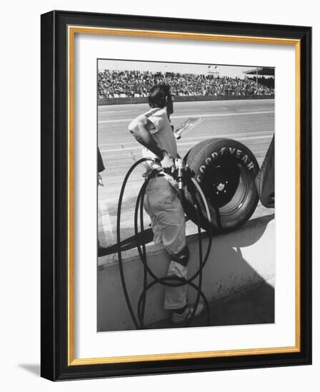 Expert Mechanic Waiting for a Car to Stop During the Daytona 500 Autorace-null-Framed Photographic Print