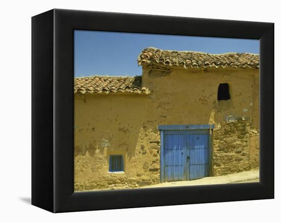 Exterior of an Adobe House with a Tile Roof and Blue Door, Salamanca, Castile Leon, Spain-Michael Busselle-Framed Premier Image Canvas