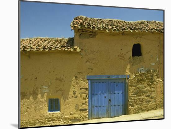 Exterior of an Adobe House with a Tile Roof and Blue Door, Salamanca, Castile Leon, Spain-Michael Busselle-Mounted Photographic Print