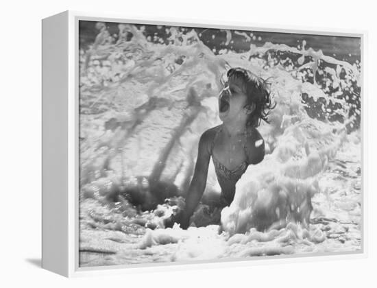 Exuberant Young Girl Getting Splashed by a Wave in the Surf at Jones Beach-Alfred Eisenstaedt-Framed Premier Image Canvas