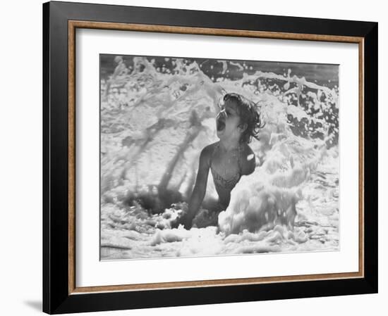 Exuberant Young Girl Getting Splashed by a Wave in the Surf at Jones Beach-Alfred Eisenstaedt-Framed Photographic Print