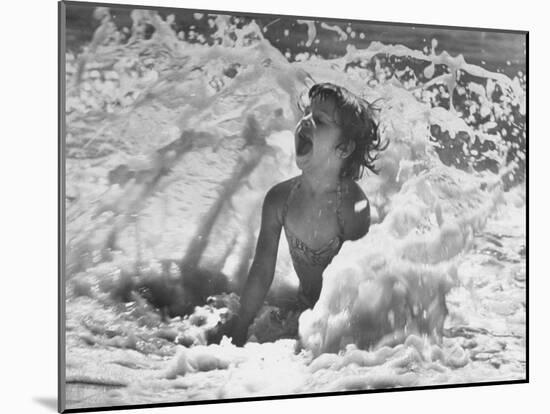 Exuberant Young Girl Getting Splashed by a Wave in the Surf at Jones Beach-Alfred Eisenstaedt-Mounted Photographic Print