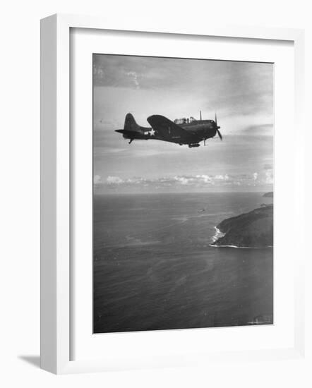 F-6 Hellcat Fighter Plane over Tanahmera Bay as Japanese Airfields at Hollandia, New Guinea-J^ R^ Eyerman-Framed Photographic Print