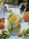 Jug of Water with Citrus Fruit, Lemon Balm and Ice Cubes-F. Strauss-Premium Photographic Print