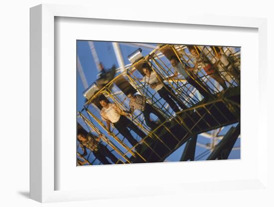 Fairgoers on a 'Round-Up' Spinning Amusement Ride at the Iowa State Fair, Des Moines, Iowa, 1955-John Dominis-Framed Photographic Print