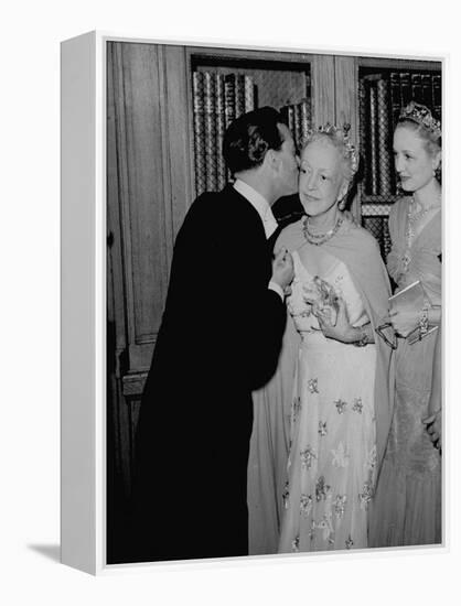 Famed Interior Decorator Lady Mendl Being Kissed by Oliver Messel at the British Embassy-William Vandivert-Framed Premier Image Canvas