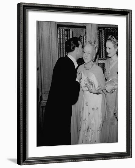 Famed Interior Decorator Lady Mendl Being Kissed by Oliver Messel at the British Embassy-William Vandivert-Framed Premium Photographic Print