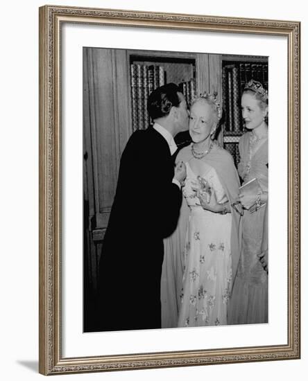 Famed Interior Decorator Lady Mendl Being Kissed by Oliver Messel at the British Embassy-William Vandivert-Framed Premium Photographic Print