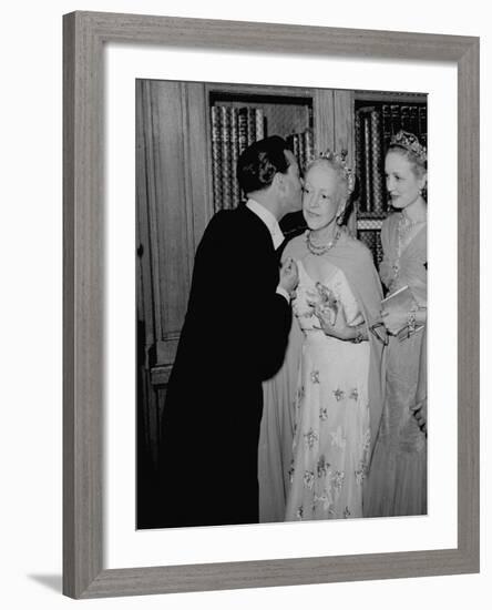 Famed Interior Decorator Lady Mendl Being Kissed by Oliver Messel at the British Embassy-William Vandivert-Framed Premium Photographic Print