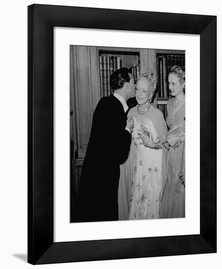 Famed Interior Decorator Lady Mendl Being Kissed by Oliver Messel at the British Embassy-William Vandivert-Framed Premium Photographic Print