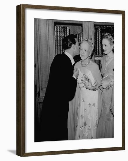 Famed Interior Decorator Lady Mendl Being Kissed by Oliver Messel at the British Embassy-William Vandivert-Framed Premium Photographic Print