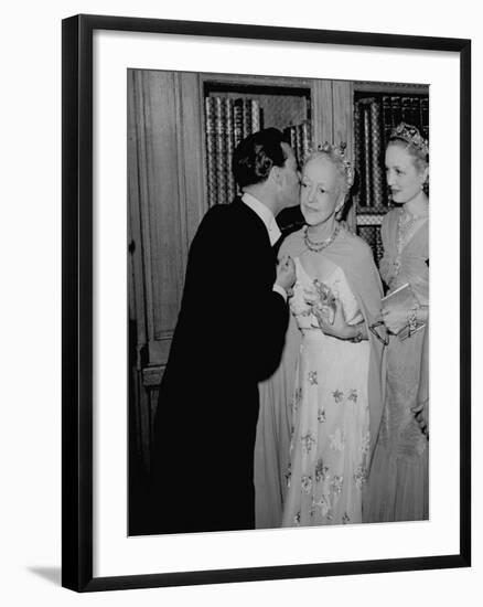 Famed Interior Decorator Lady Mendl Being Kissed by Oliver Messel at the British Embassy-William Vandivert-Framed Premium Photographic Print