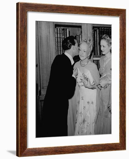 Famed Interior Decorator Lady Mendl Being Kissed by Oliver Messel at the British Embassy-William Vandivert-Framed Premium Photographic Print