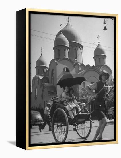 Family Being Pulled in a Rickshaw with a Russian Orthodox Church in the Background-Jack Birns-Framed Premier Image Canvas