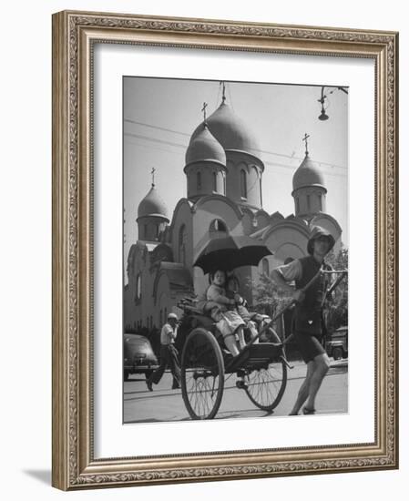 Family Being Pulled in a Rickshaw with a Russian Orthodox Church in the Background-Jack Birns-Framed Photographic Print