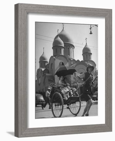 Family Being Pulled in a Rickshaw with a Russian Orthodox Church in the Background-Jack Birns-Framed Photographic Print