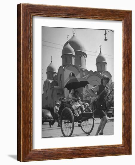 Family Being Pulled in a Rickshaw with a Russian Orthodox Church in the Background-Jack Birns-Framed Photographic Print