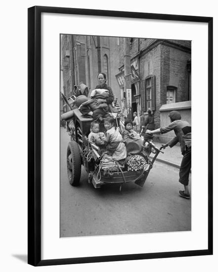 Family Fleeing Shanghai-null-Framed Photographic Print