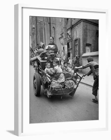 Family Fleeing Shanghai-null-Framed Photographic Print