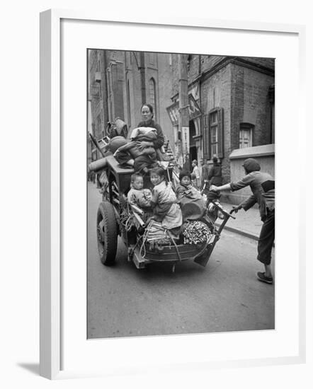 Family Fleeing Shanghai-null-Framed Photographic Print