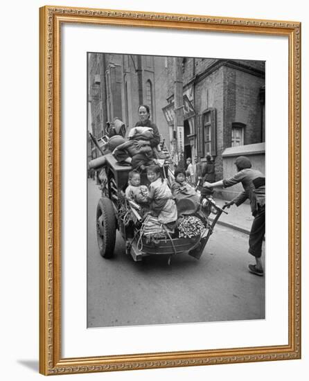 Family Fleeing Shanghai-null-Framed Photographic Print