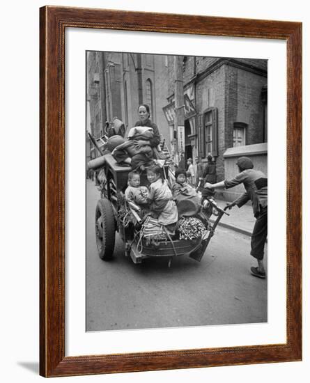 Family Fleeing Shanghai-null-Framed Photographic Print