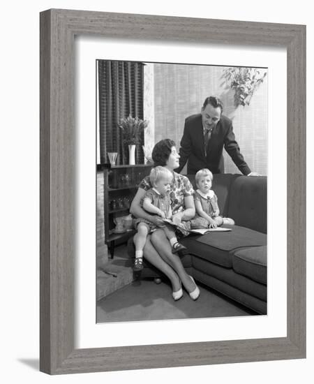 Family Group Looking at a Brochure, Doncaster, South Yorkshire, 1963-Michael Walters-Framed Photographic Print