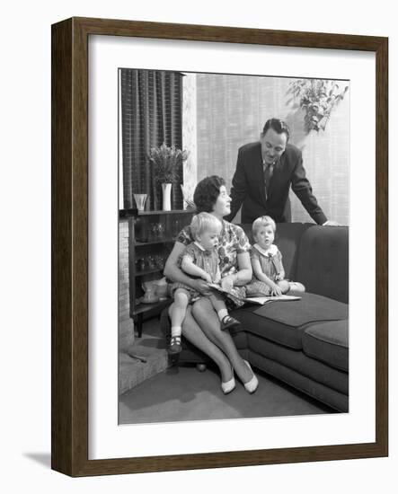 Family Group Looking at a Brochure, Doncaster, South Yorkshire, 1963-Michael Walters-Framed Photographic Print