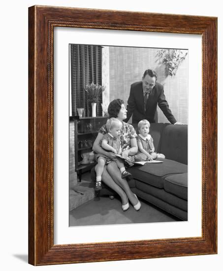 Family Group Looking at a Brochure, Doncaster, South Yorkshire, 1963-Michael Walters-Framed Photographic Print