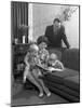 Family Group Looking at a Brochure, Doncaster, South Yorkshire, 1963-Michael Walters-Mounted Photographic Print