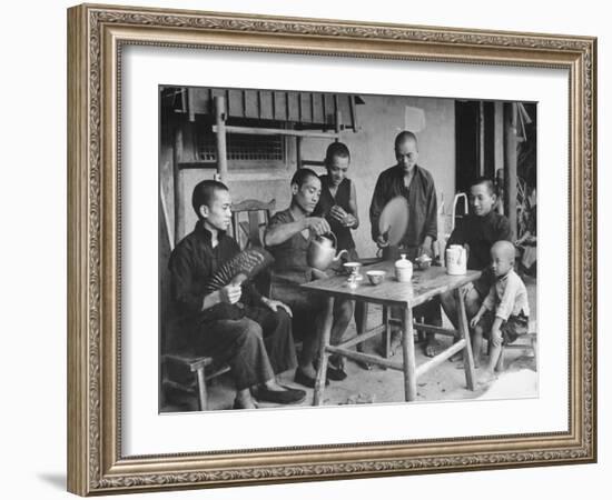 Family Having Tea in Courtyard-Carl Mydans-Framed Photographic Print