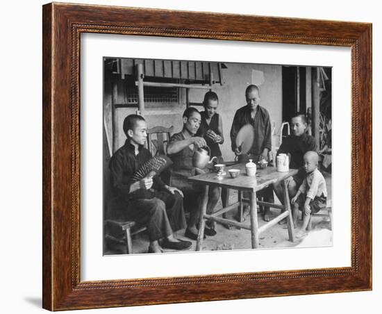 Family Having Tea in Courtyard-Carl Mydans-Framed Photographic Print