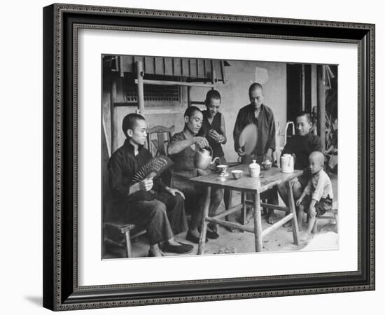 Family Having Tea in Courtyard-Carl Mydans-Framed Photographic Print