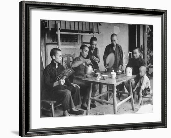 Family Having Tea in Courtyard-Carl Mydans-Framed Photographic Print